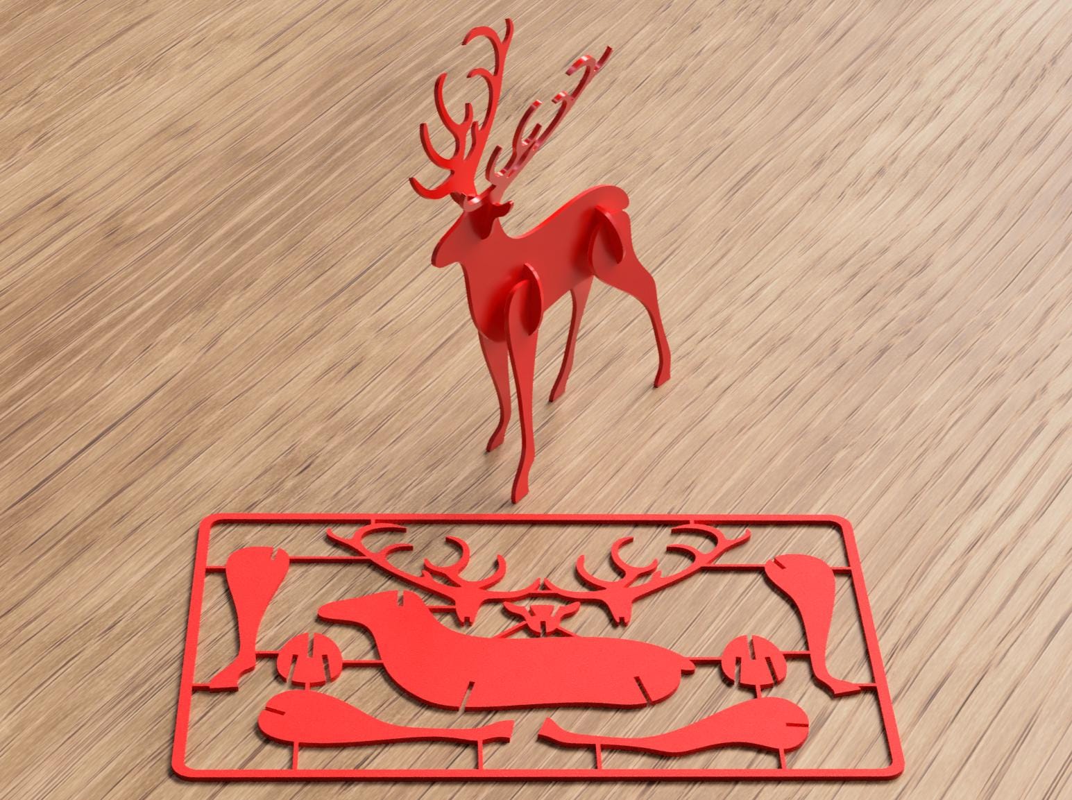 Red Plastic cutout of a deer on a wooden surface
