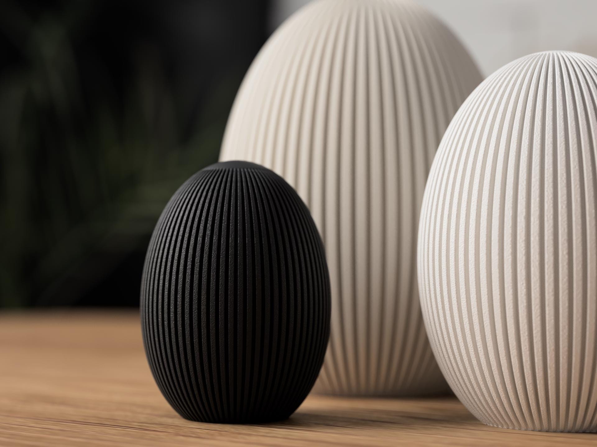 Black and beige textured spherical objects on a wooden surface