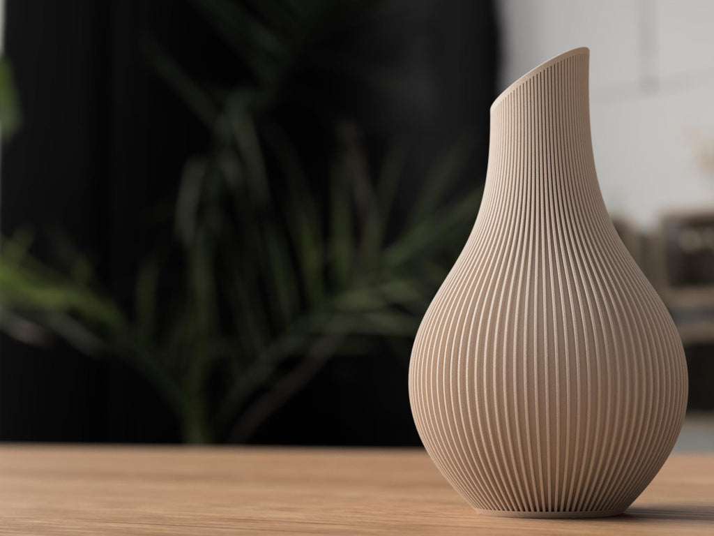 Beige textured vase on a wooden surface with a blurred background