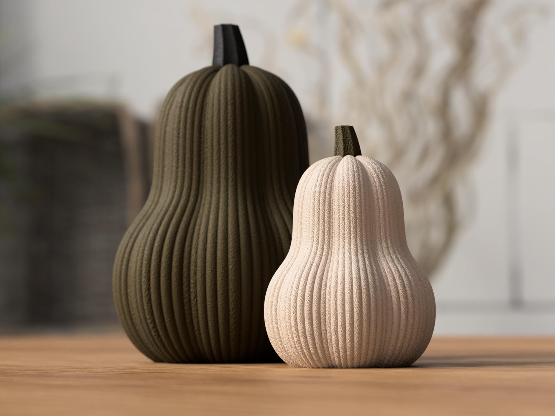 Two ribbed gourds, one green and one beige, on a wooden surface with a blurred background.