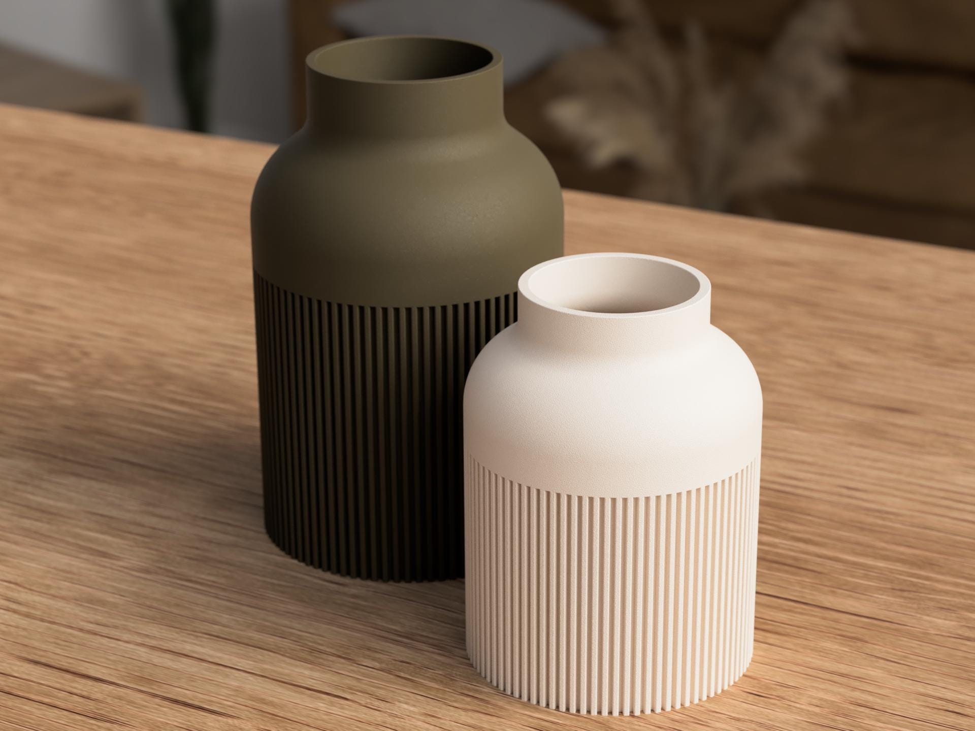 Two vases, one black and one white, on a wooden surface.
