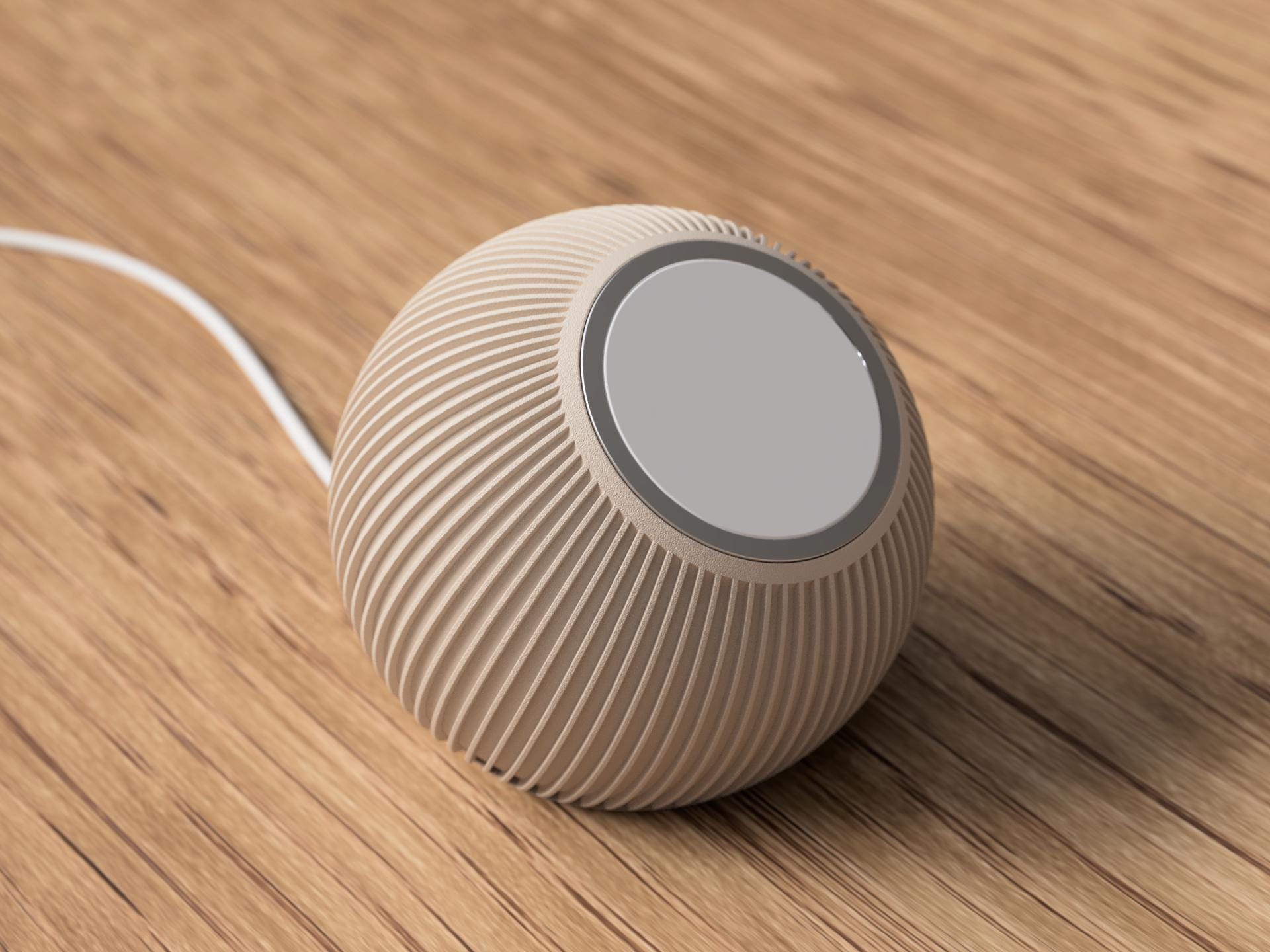 Round beige speaker with ribbed texture on a wooden surface