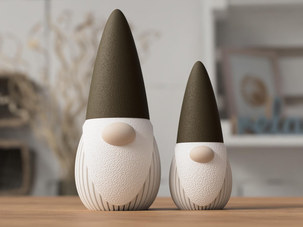 Two decorative gnomes with brown hats on a wooden surface.