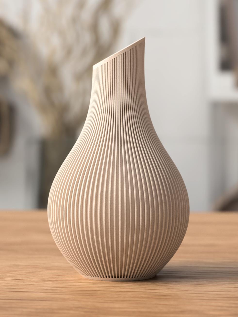 Beige ceramic vase with ribbed texture on a wooden surface