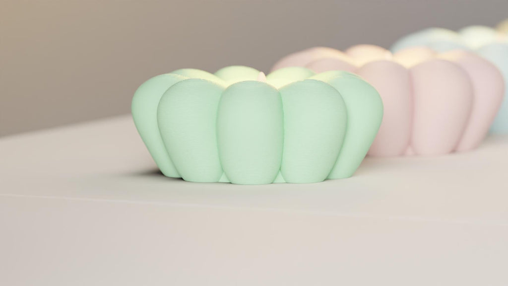 Pastel-colored pumpkin-shaped objects on a neutral background