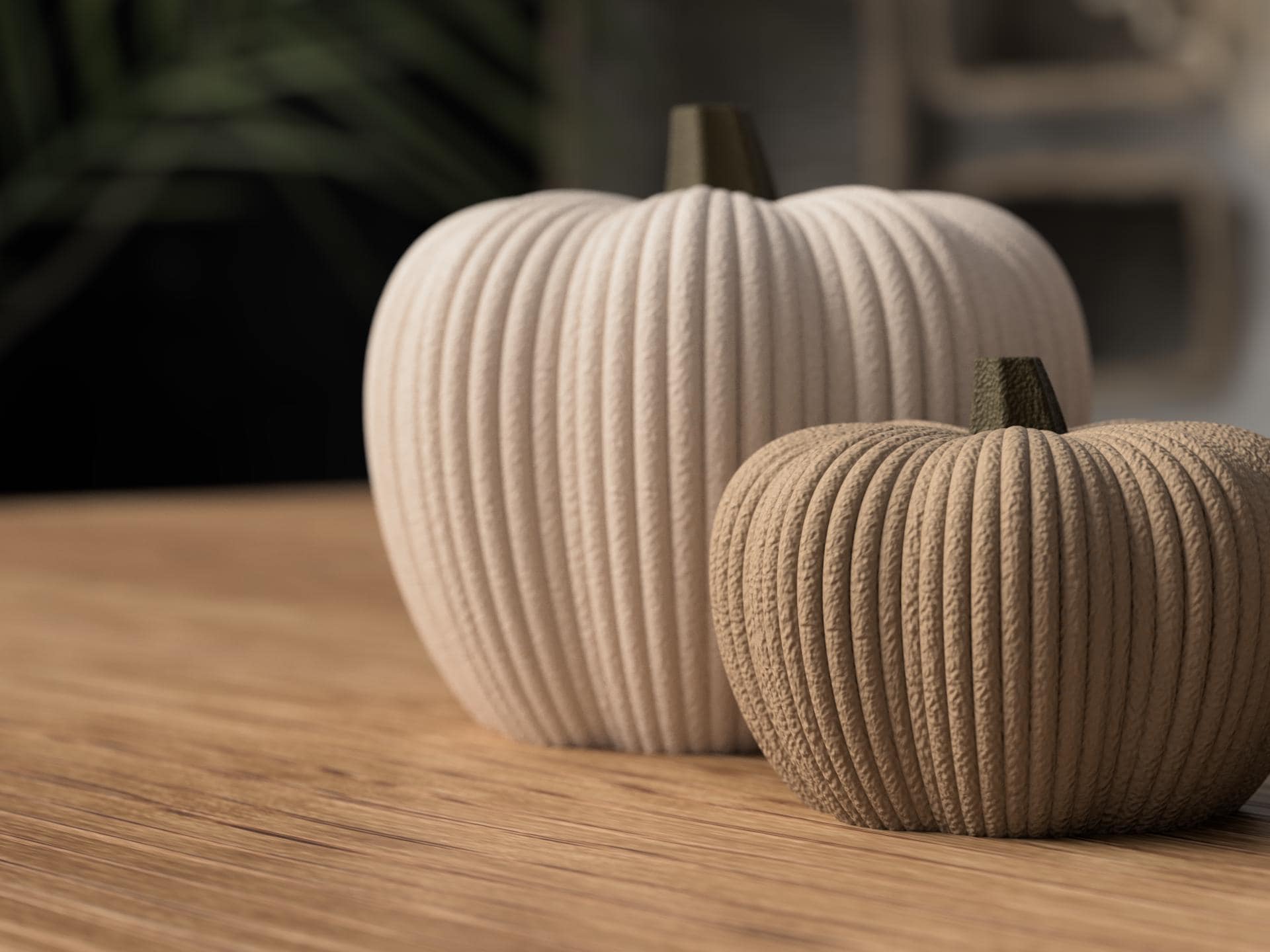 Two textured pumpkins on a wooden surface with a blurred background