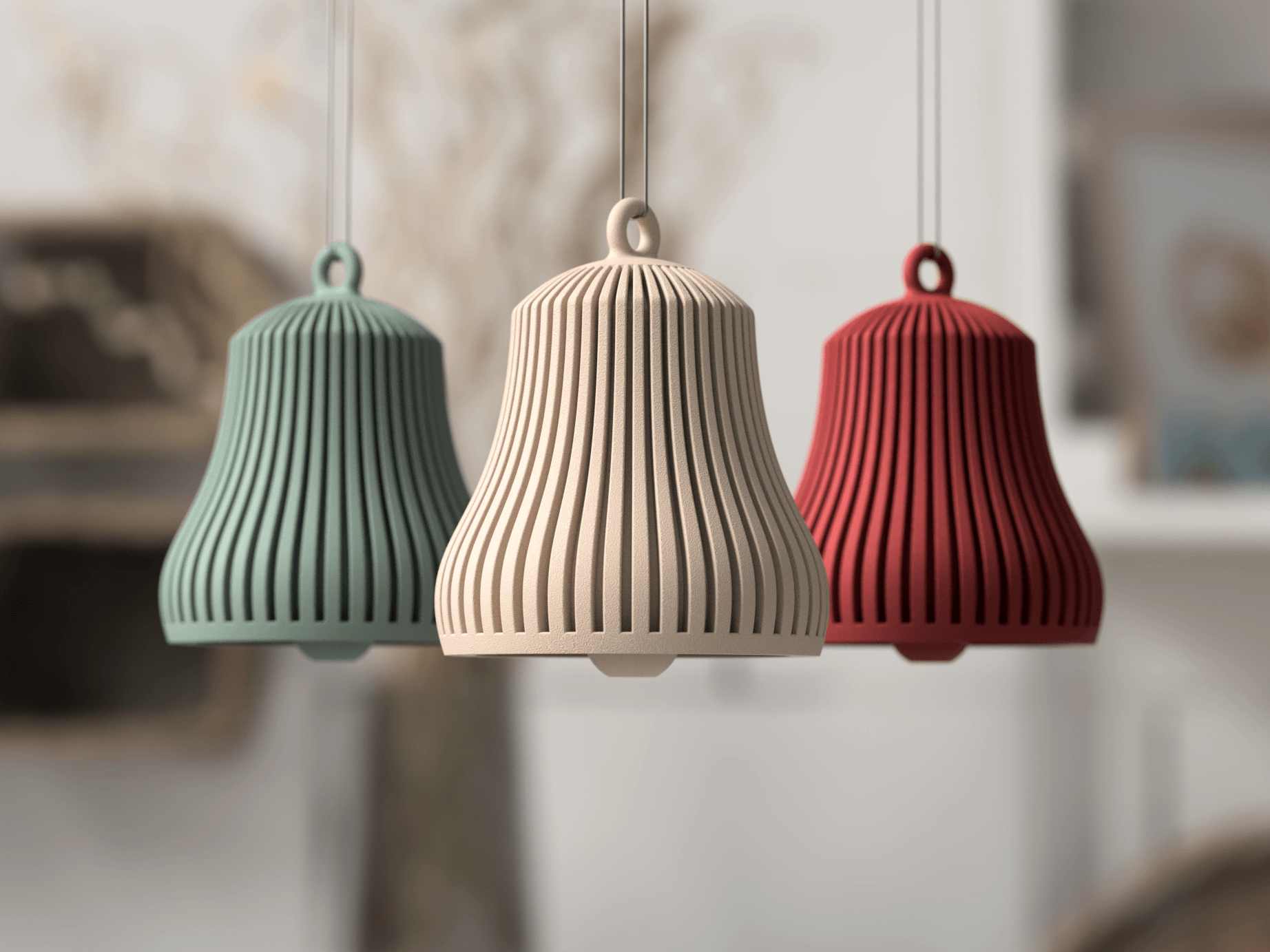 Three ribbed pendant lights in green, beige, and red hanging against a blurred indoor background.