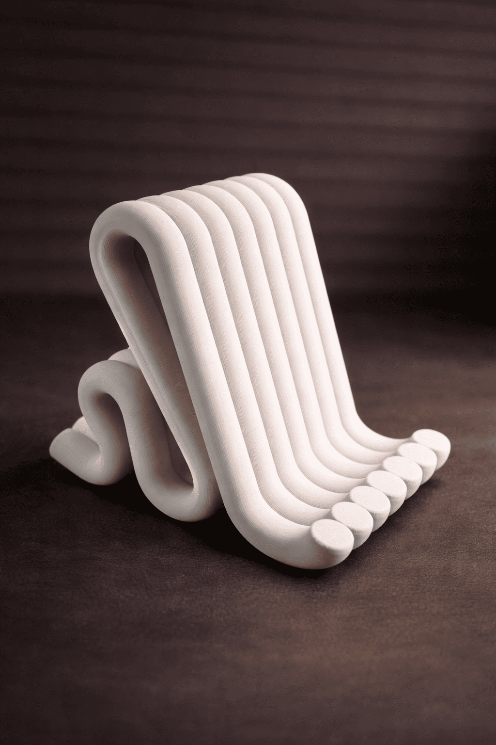 White ceramic footstool with wavy design on a dark brown background