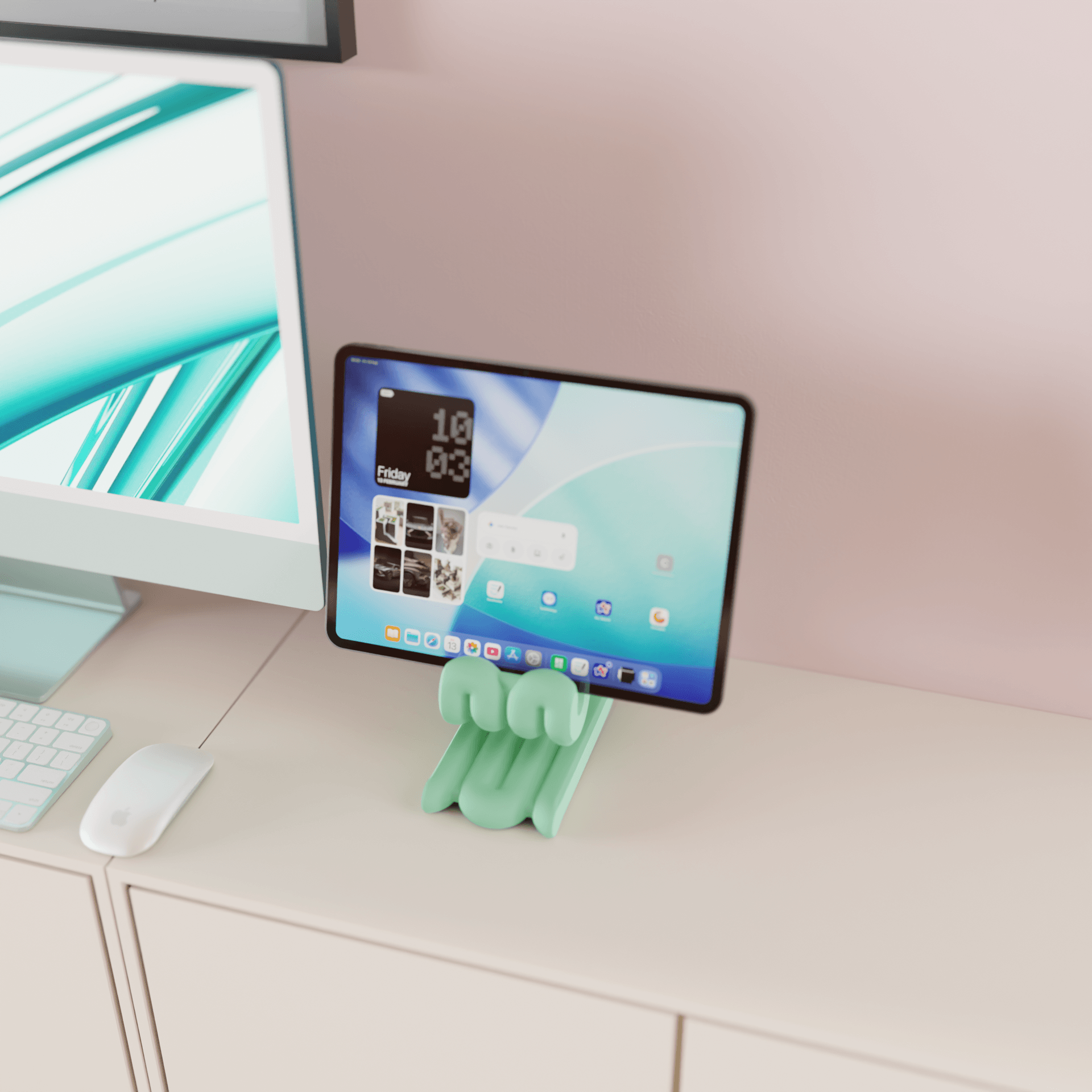 Tablet on a green stand with a computer monitor in the background