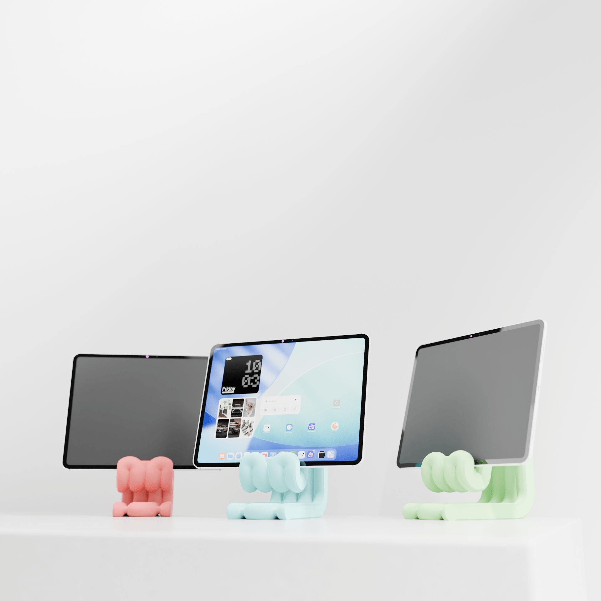 Three tablet stands in different colors on a white background