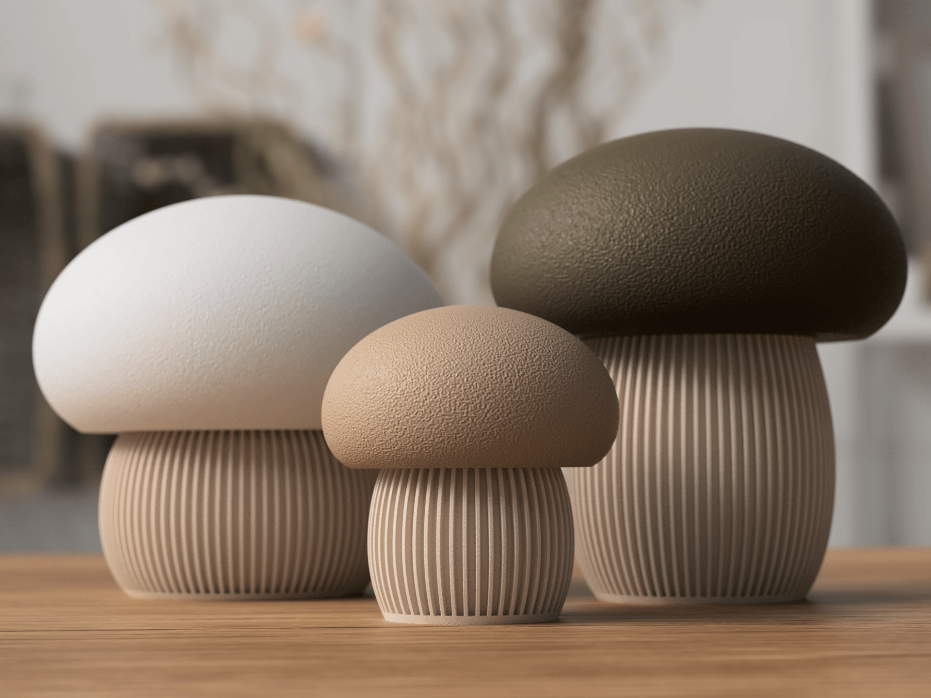 Three ceramic mushroom-shaped objects on a wooden surface with a blurred background