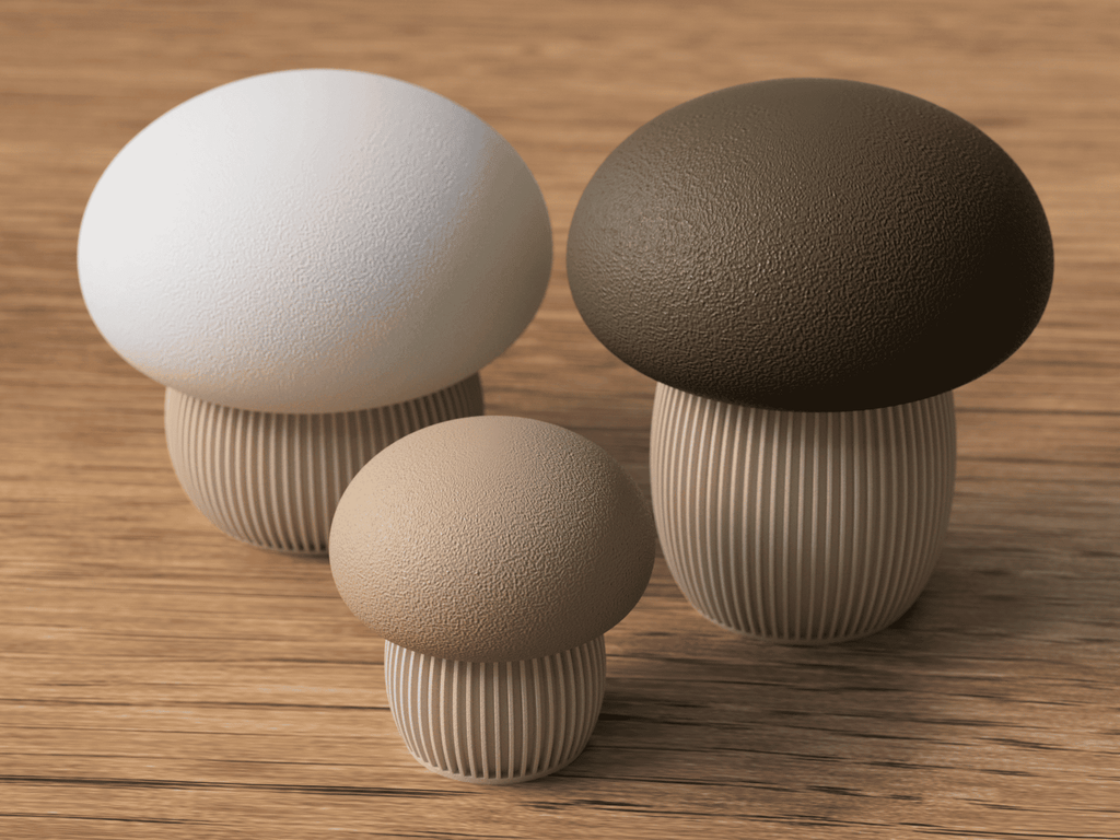 Four mushroom-shaped objects in different colors on a wooden surface
