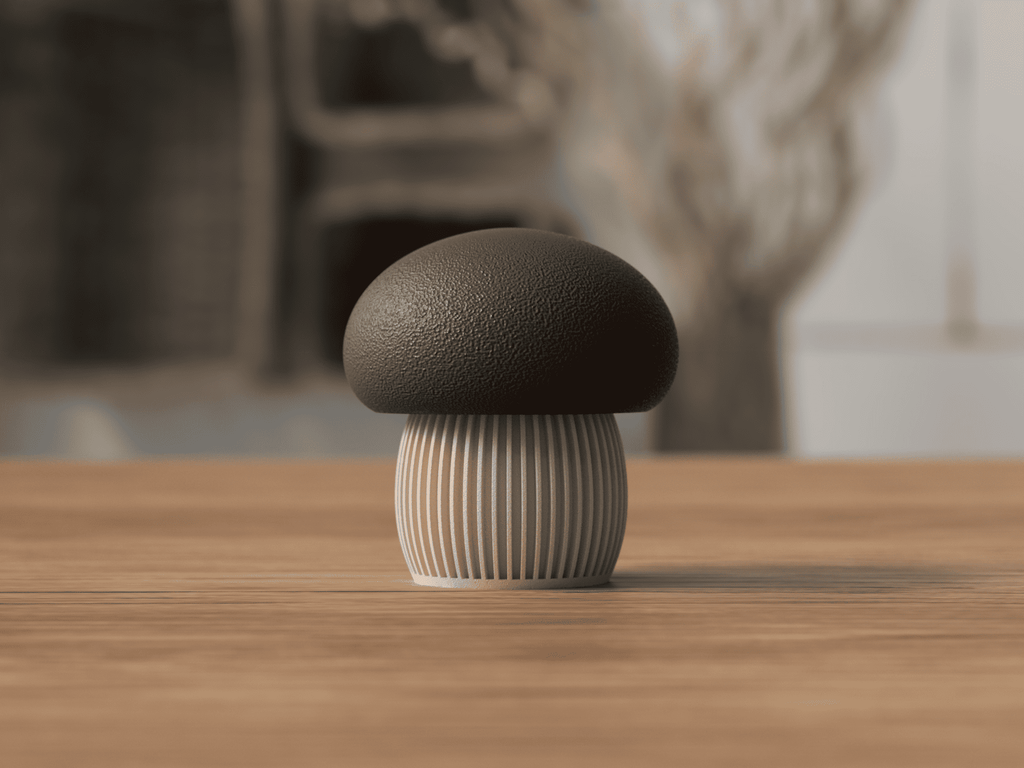 Mushroom-shaped object on a wooden surface with a blurred natural background