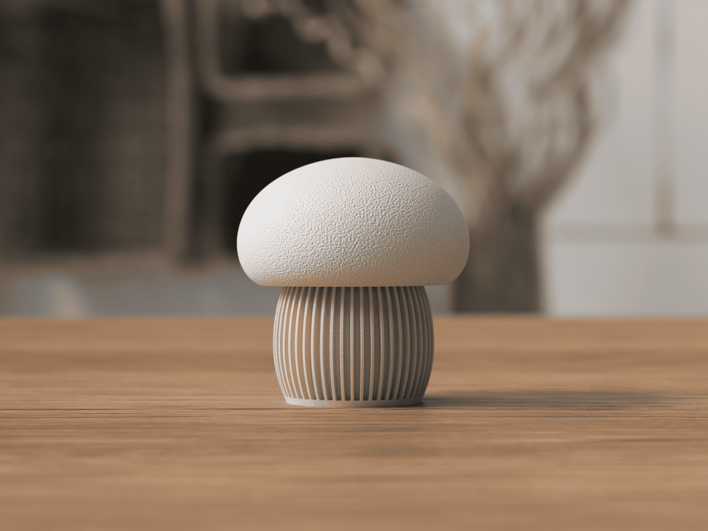 Mushroom-shaped decorative item on a wooden surface with a blurred natural background