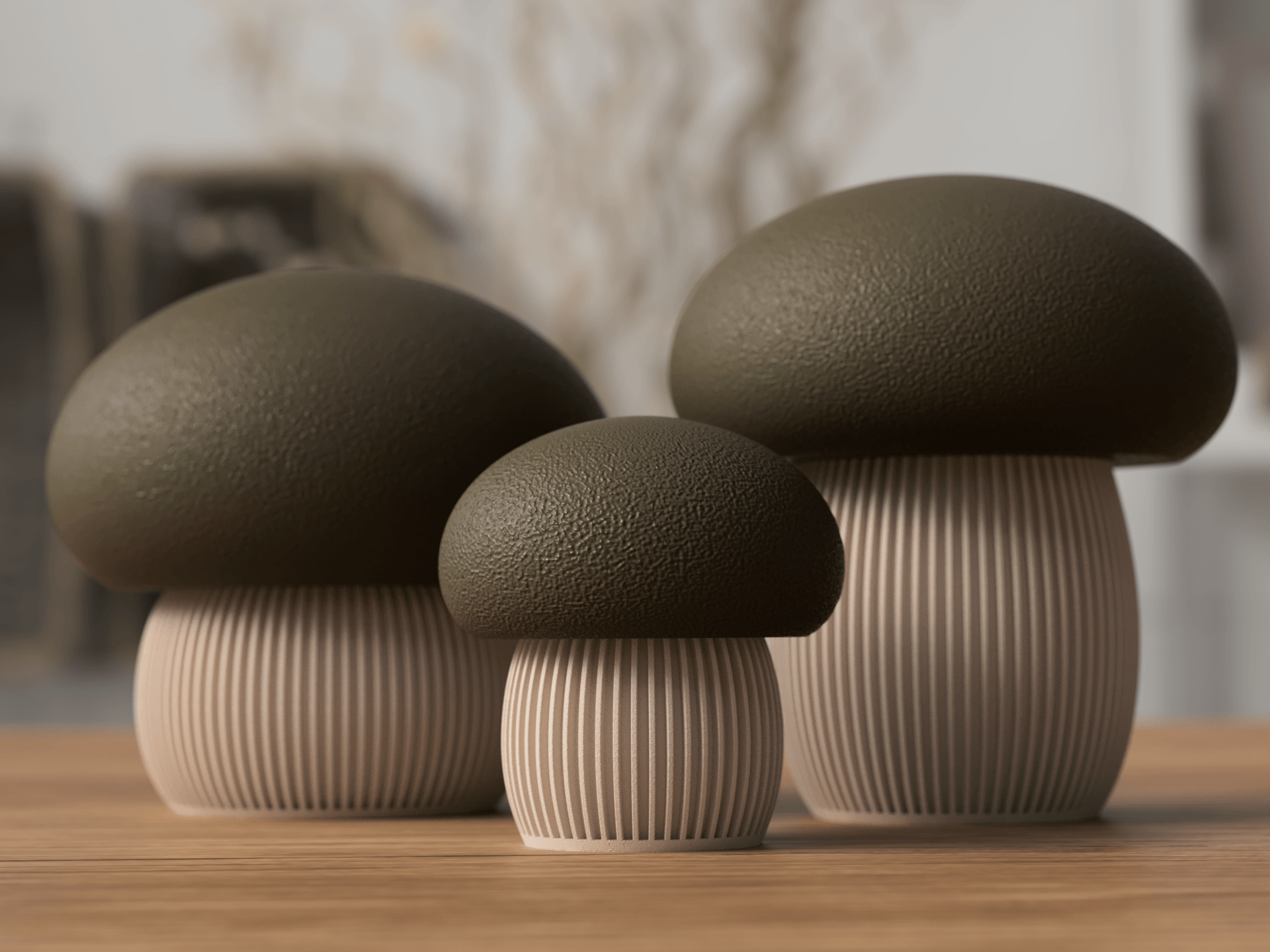 Three mushroom-shaped decorative items on a wooden surface with a blurred background
