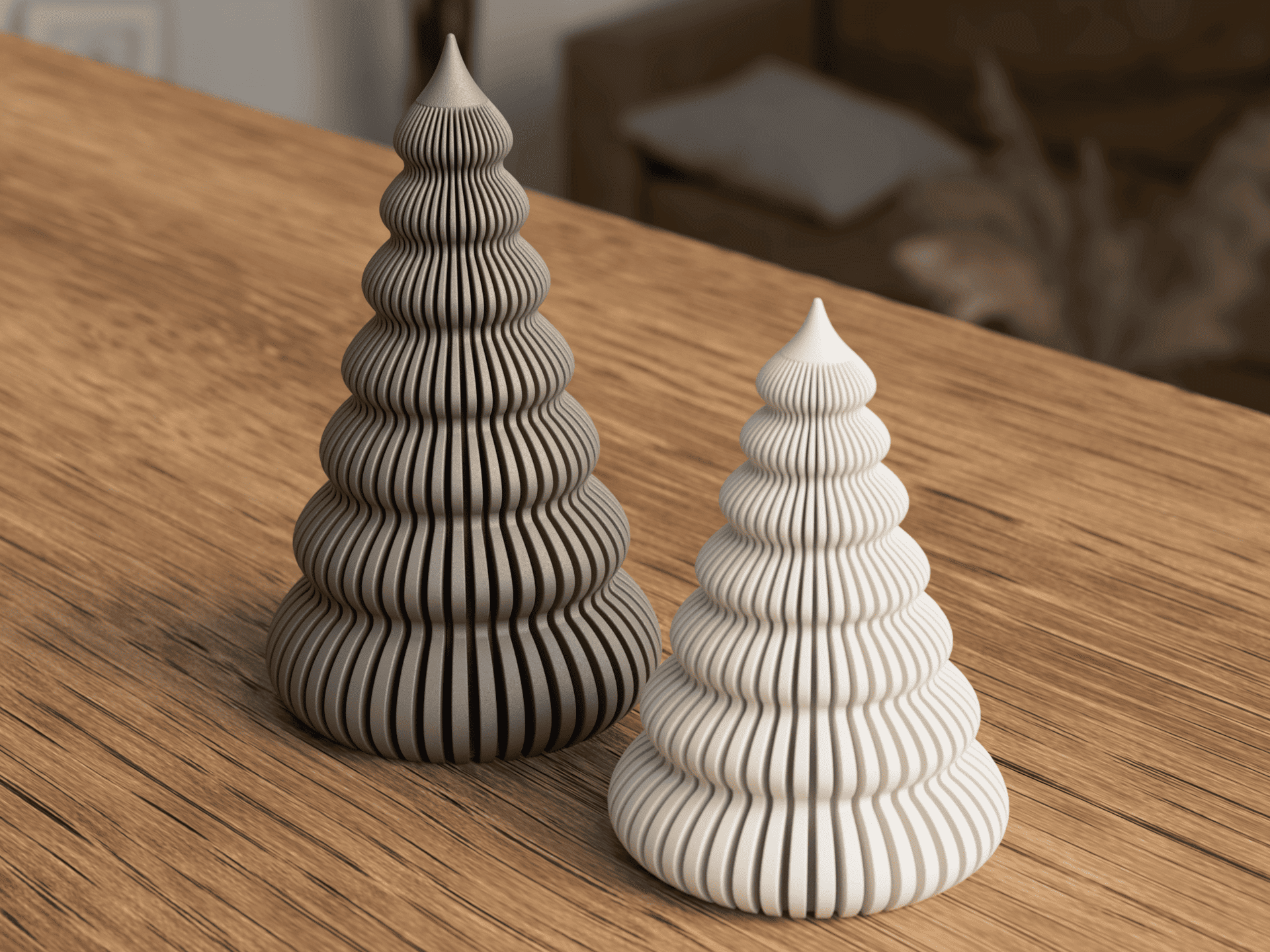 Two decorative ceramic trees on a wooden surface