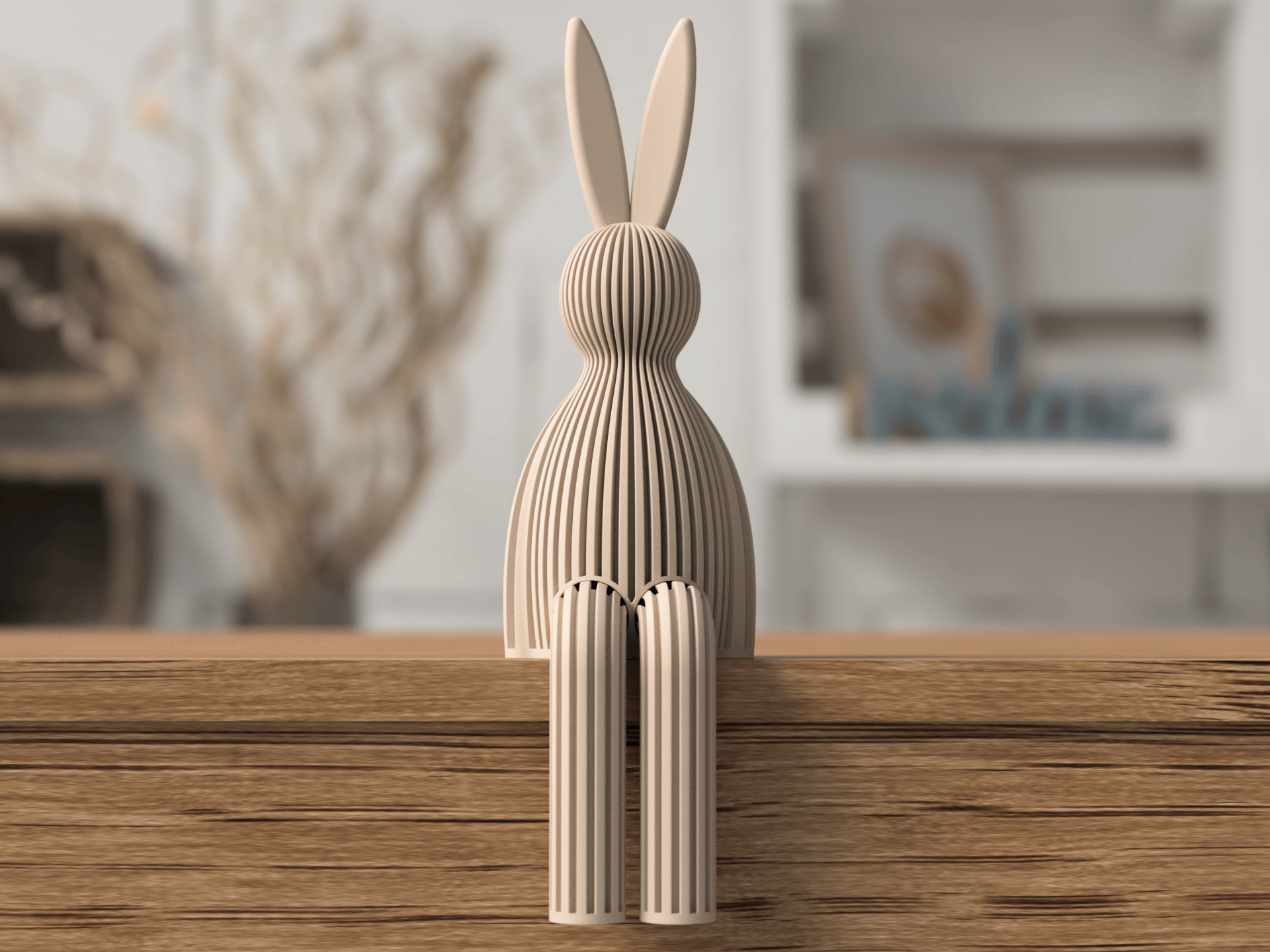 Wooden rabbit sculpture on a wooden surface with a blurred indoor background