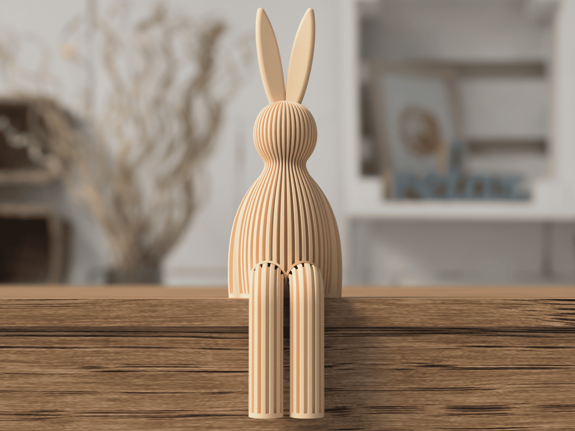 Wooden rabbit sculpture on a wooden surface with a blurred indoor background