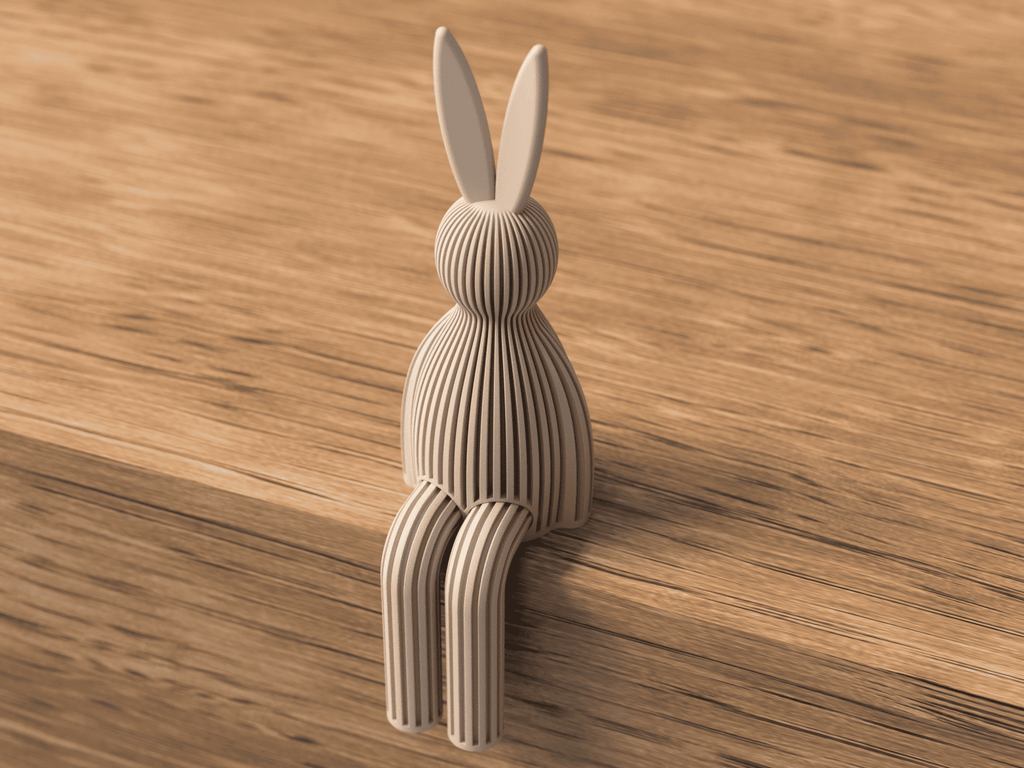 3D-printed rabbit sculpture on a wooden surface
