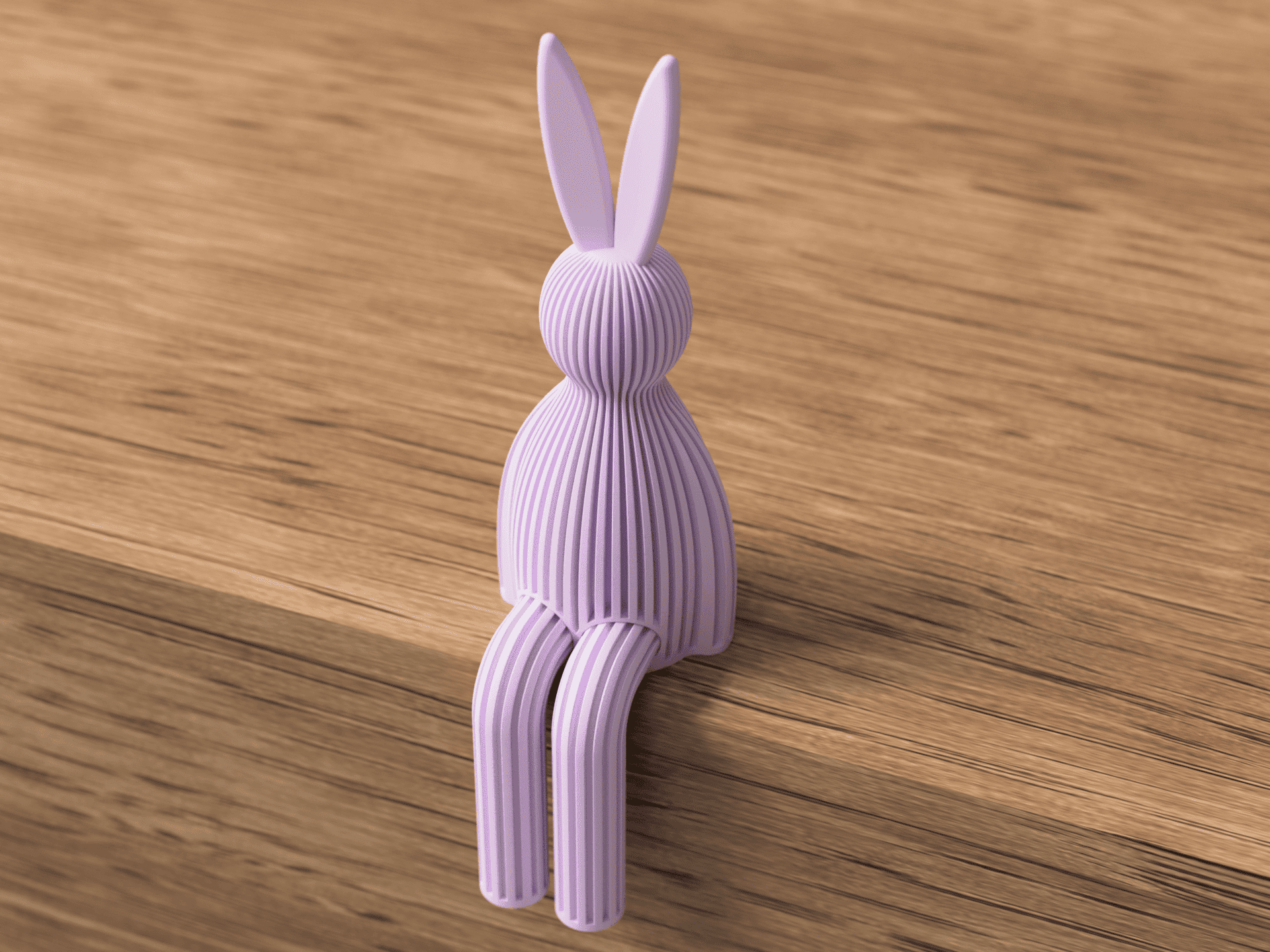 Purple rabbit-shaped object on a wooden surface