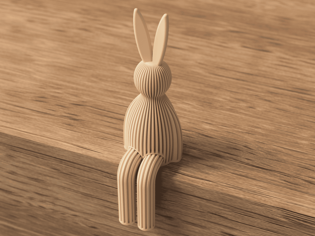 Wooden rabbit-shaped object on a wooden surface