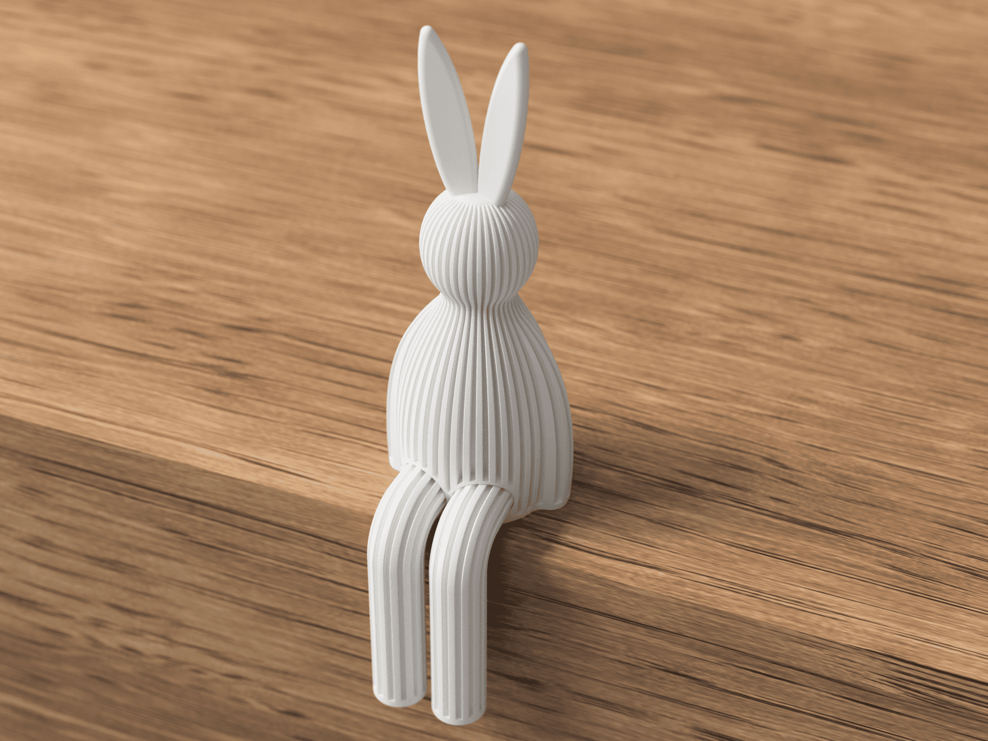 White rabbit-shaped hook on a wooden surface