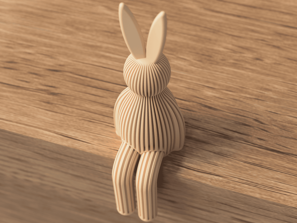 Wooden rabbit-shaped object on a wooden surface