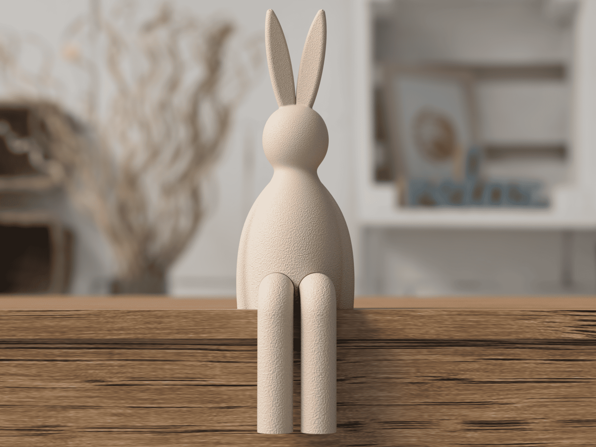 Wooden rabbit sculpture on a wooden surface with a blurred indoor background