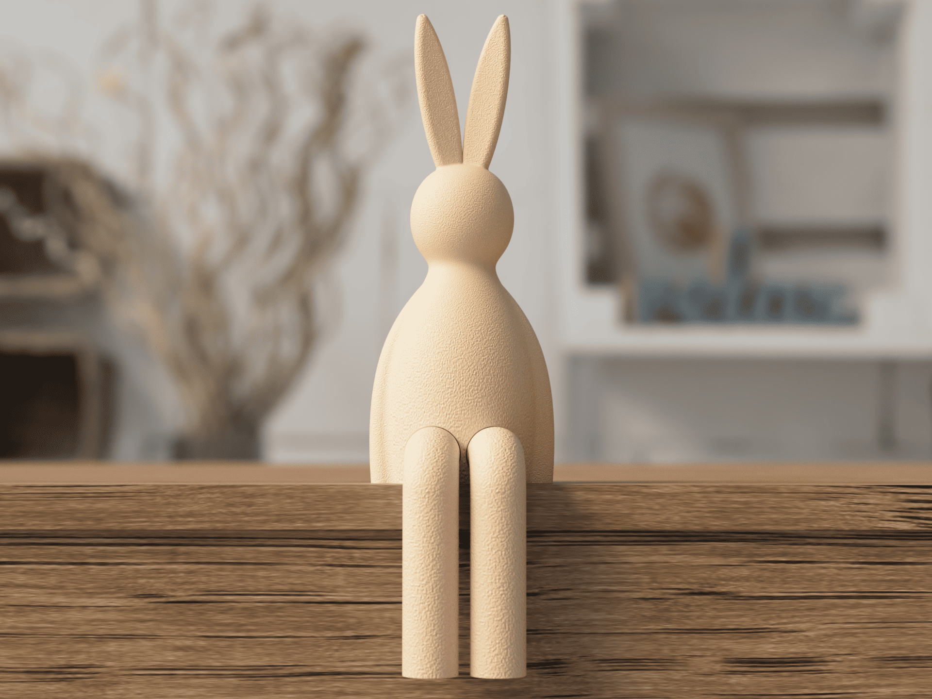 Wooden rabbit figurine on a wooden surface with a blurred indoor background