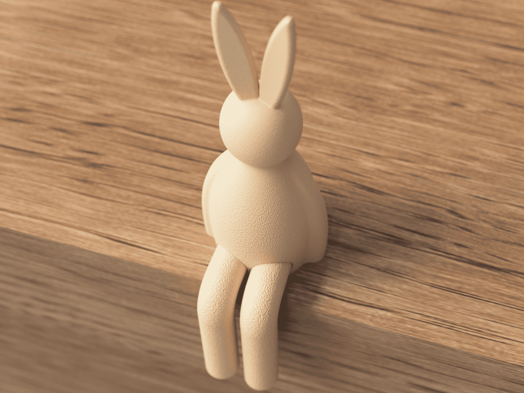 Wooden rabbit-shaped hook on a wooden surface