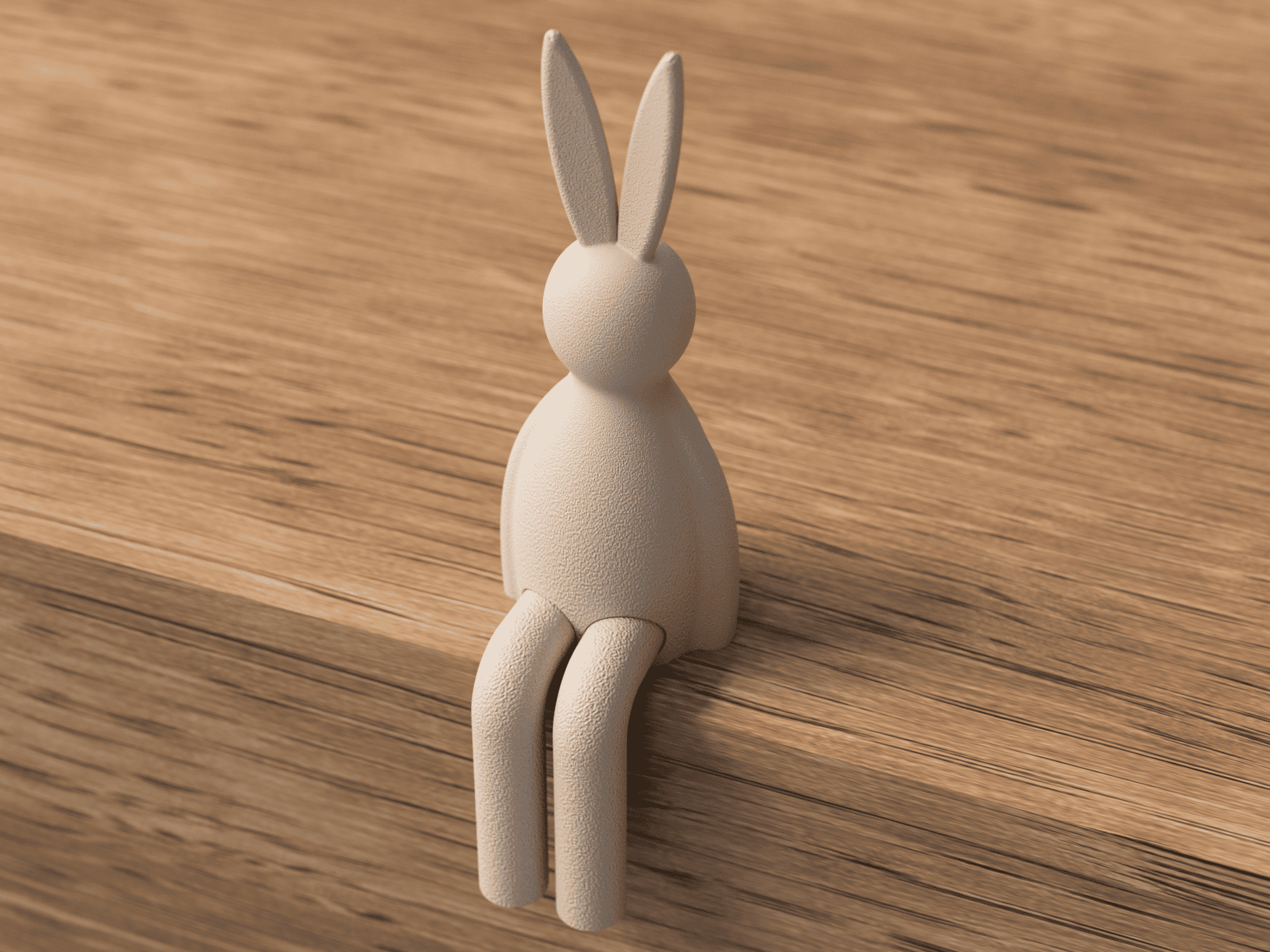 Beige rabbit-shaped hook on a wooden surface