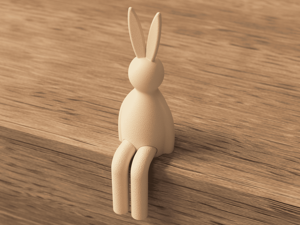 Wooden rabbit-shaped hook on a wooden surface