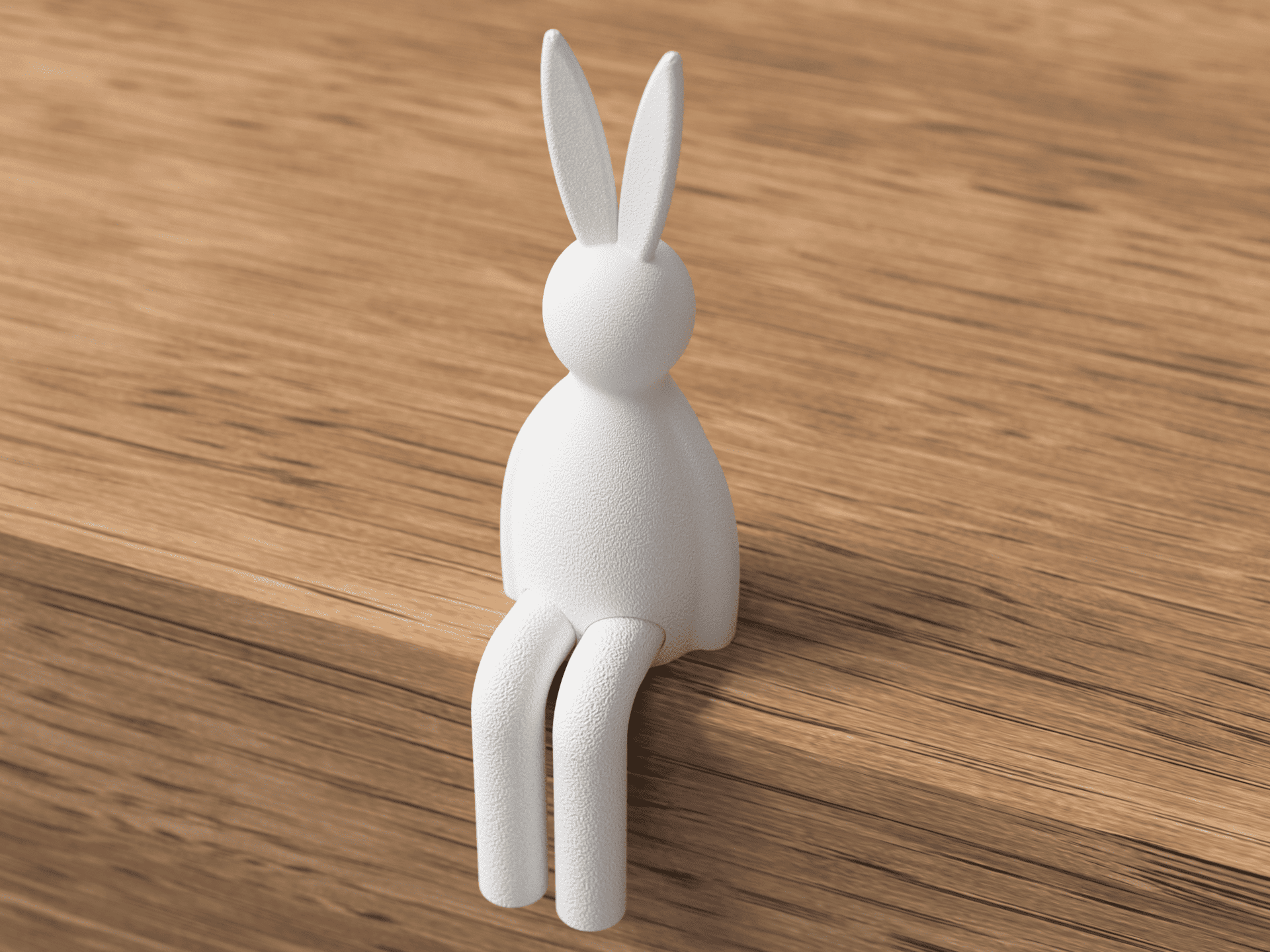 White rabbit-shaped object on a wooden surface
