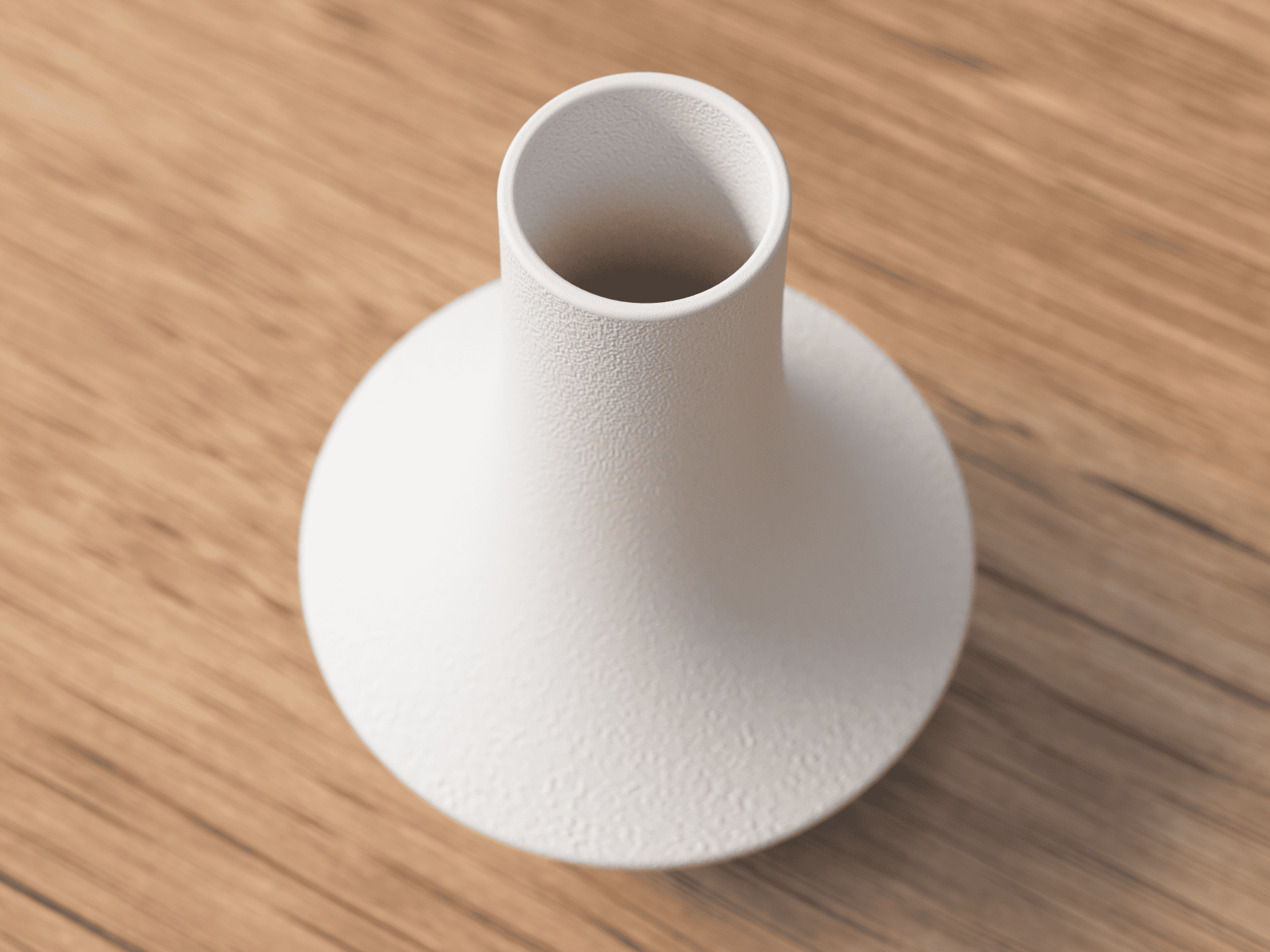 White ceramic vase on a wooden surface