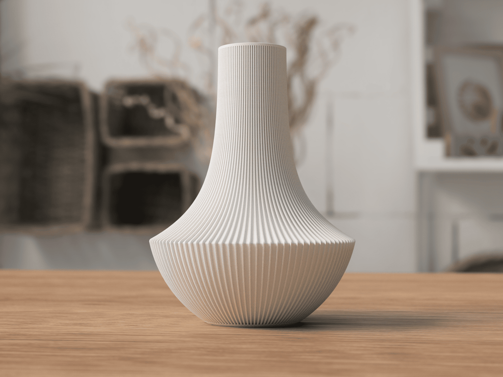 White textured vase on a wooden table with a blurred indoor background
