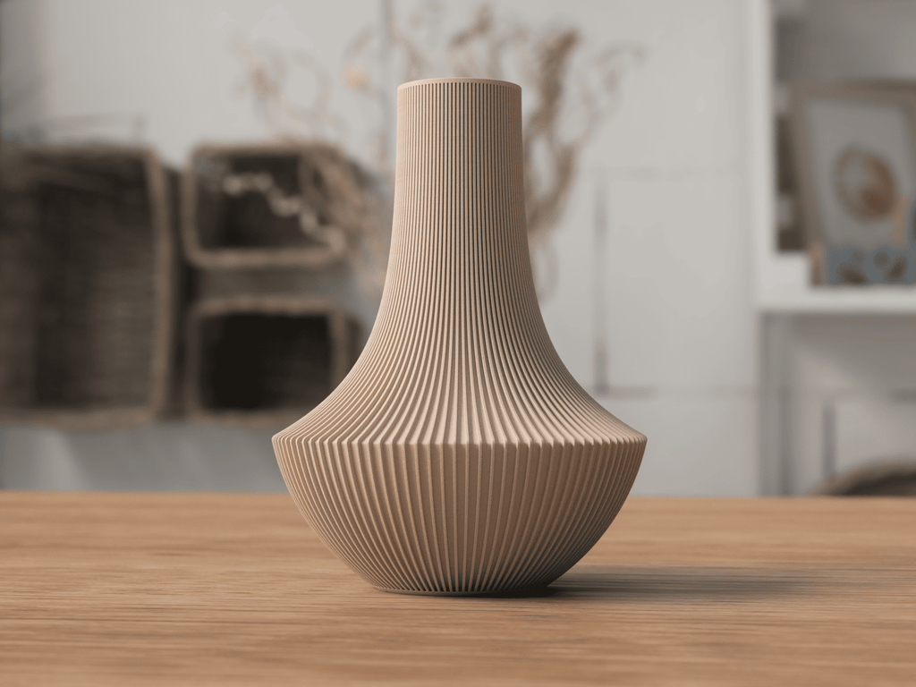 Beige textured vase on a wooden surface with a blurred indoor background