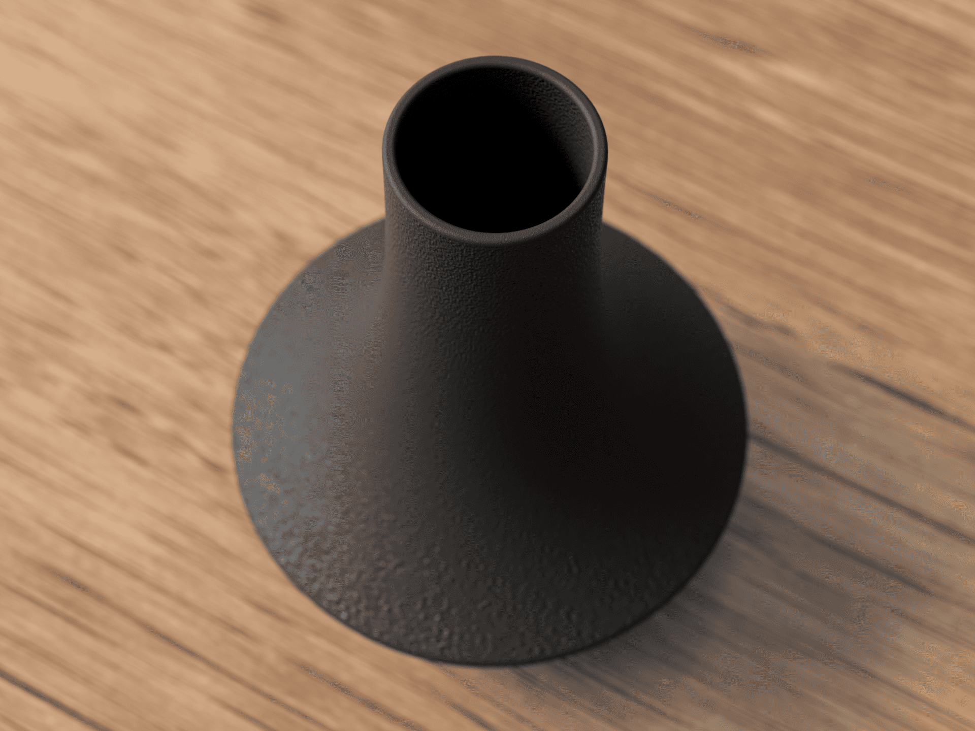 Black vase on a wooden surface