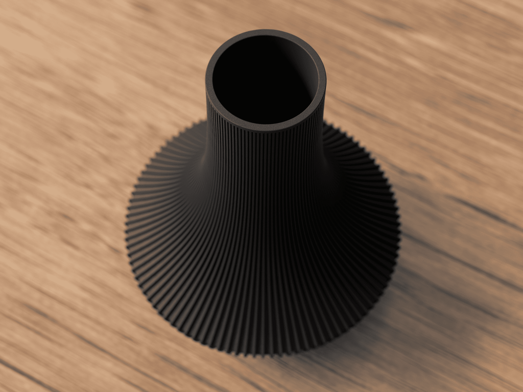 Black textured vase on a wooden surface