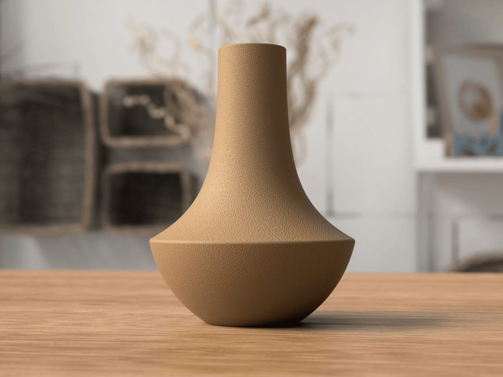 Brown textured vase on a wooden surface with a blurred indoor background