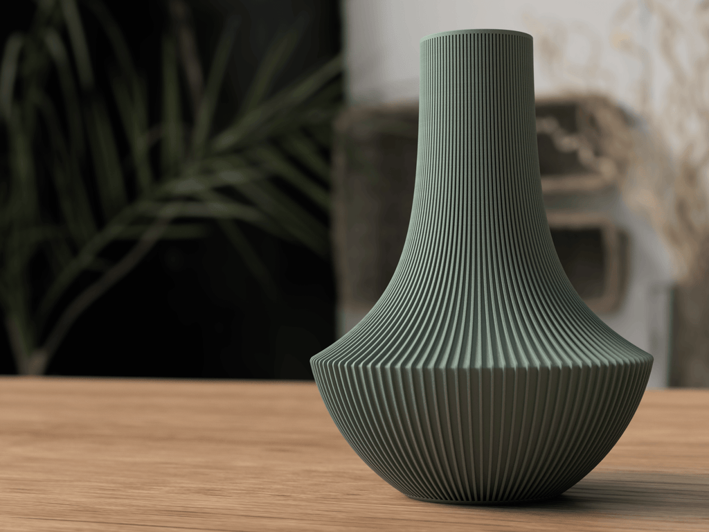 Green textured vase on a wooden surface with a blurred background