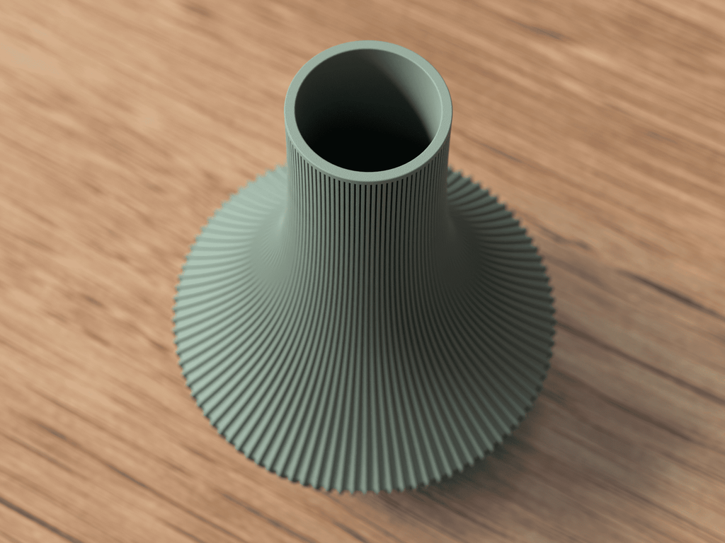 Green textured vase on a wooden surface