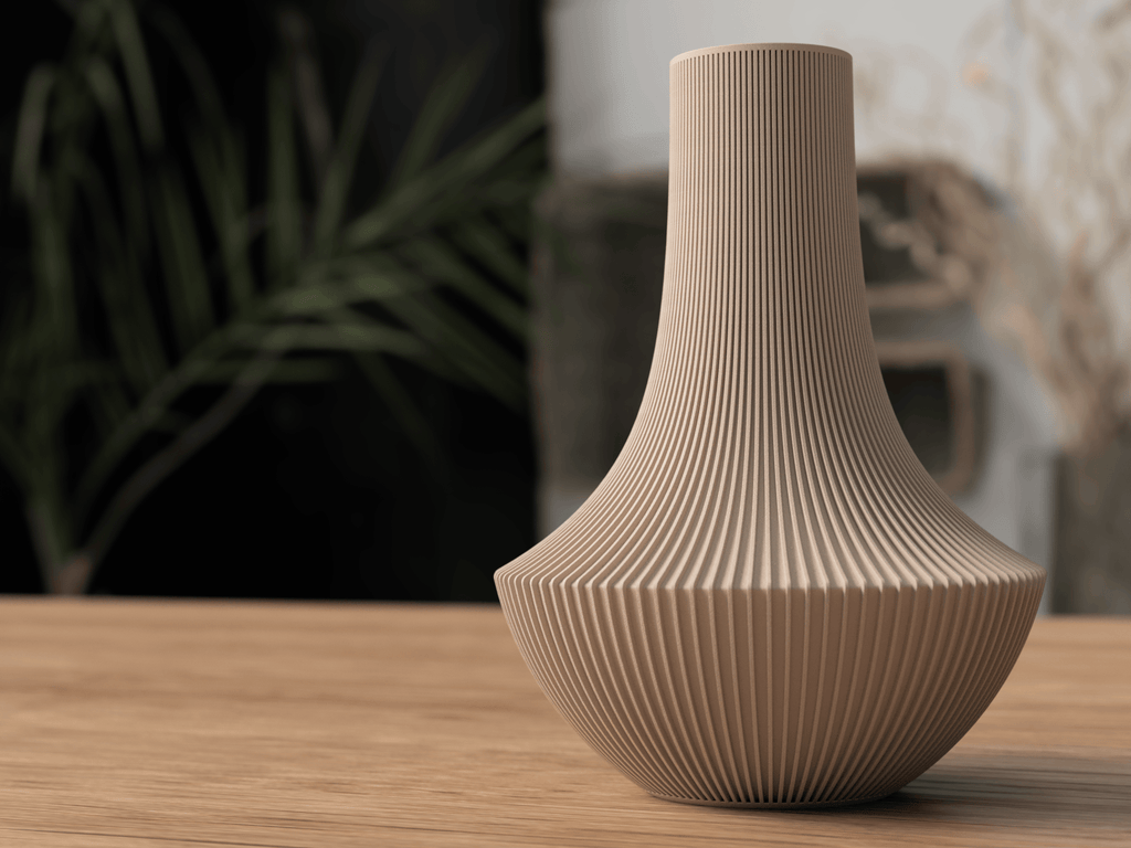 Beige textured vase on a wooden surface with a blurred background
