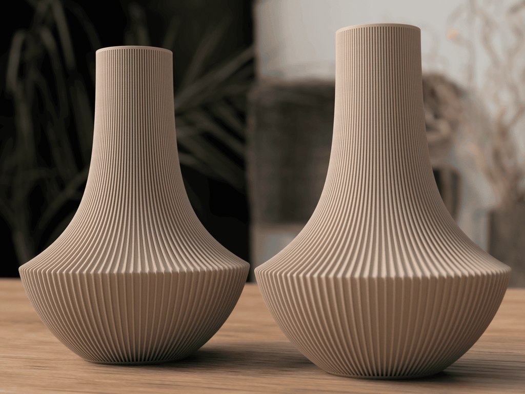 Two beige textured vases on a wooden surface with a blurred background