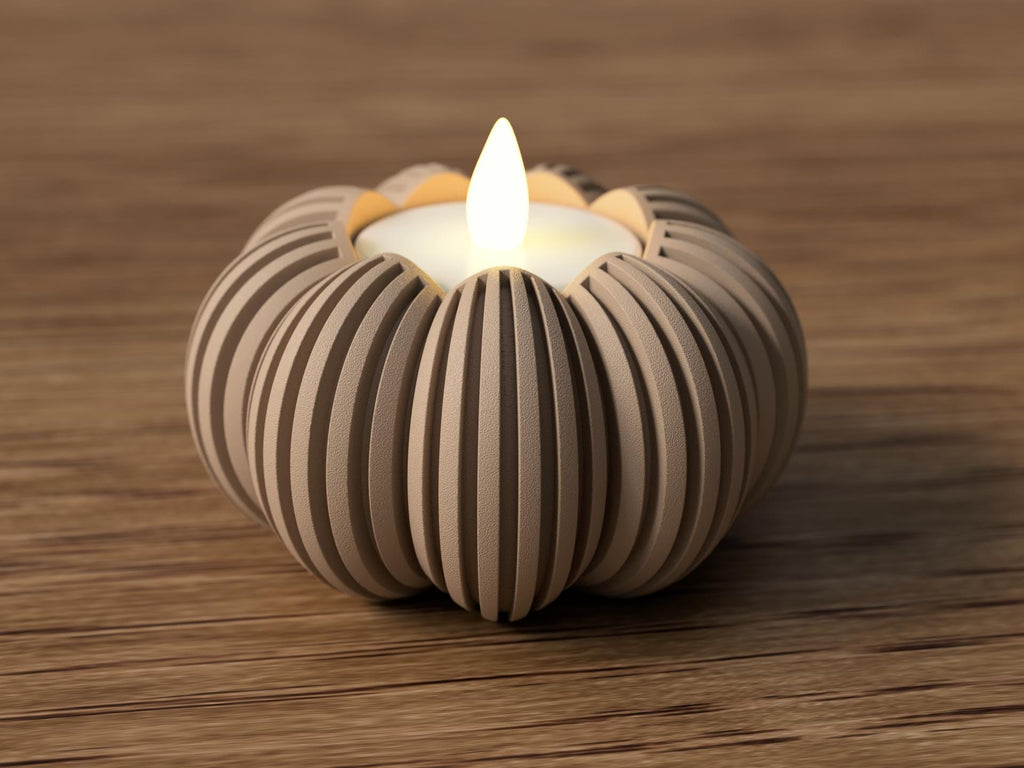 Candle in a decorative striped holder on a wooden surface