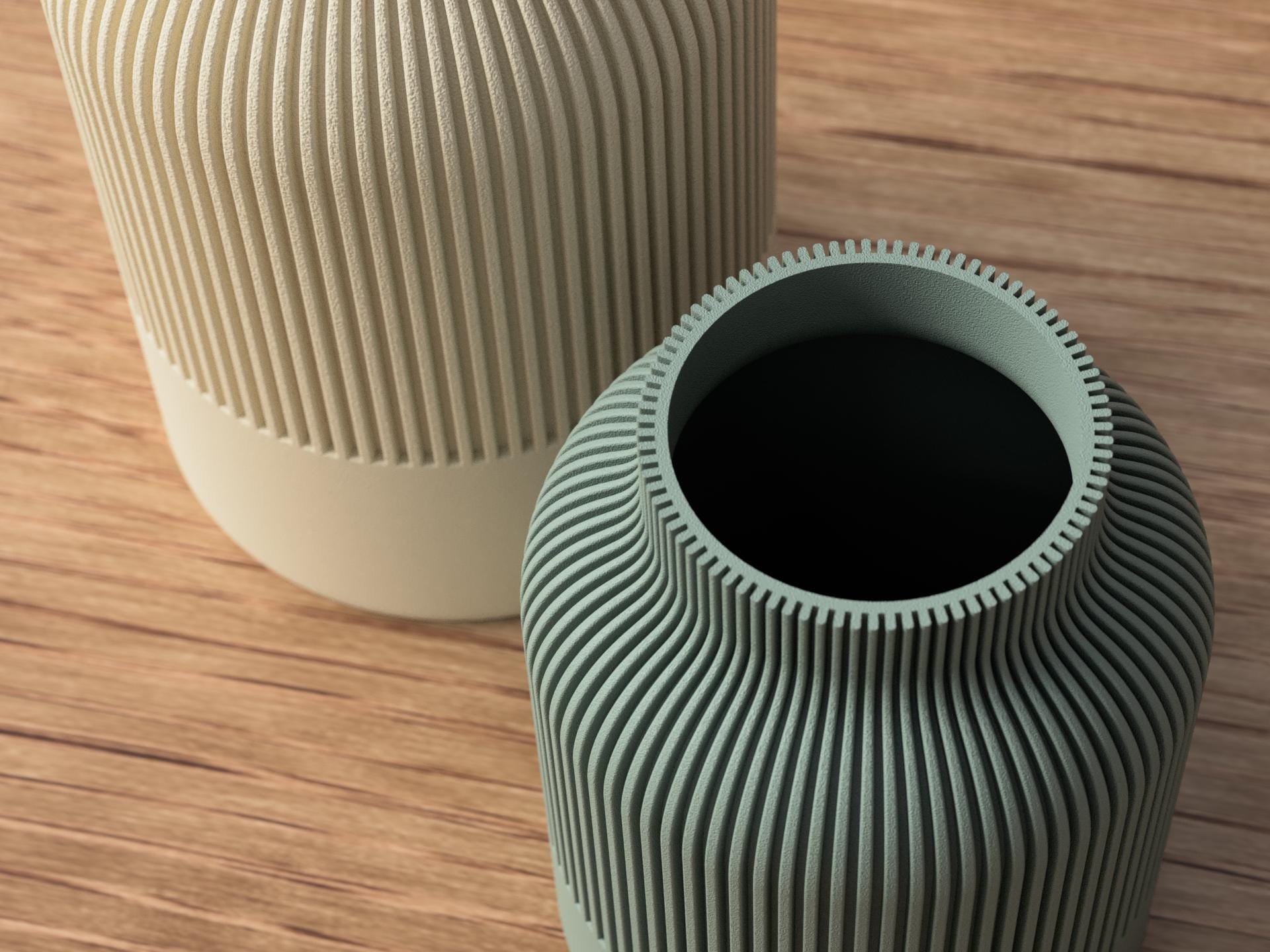 Two textured vases on a wooden surface