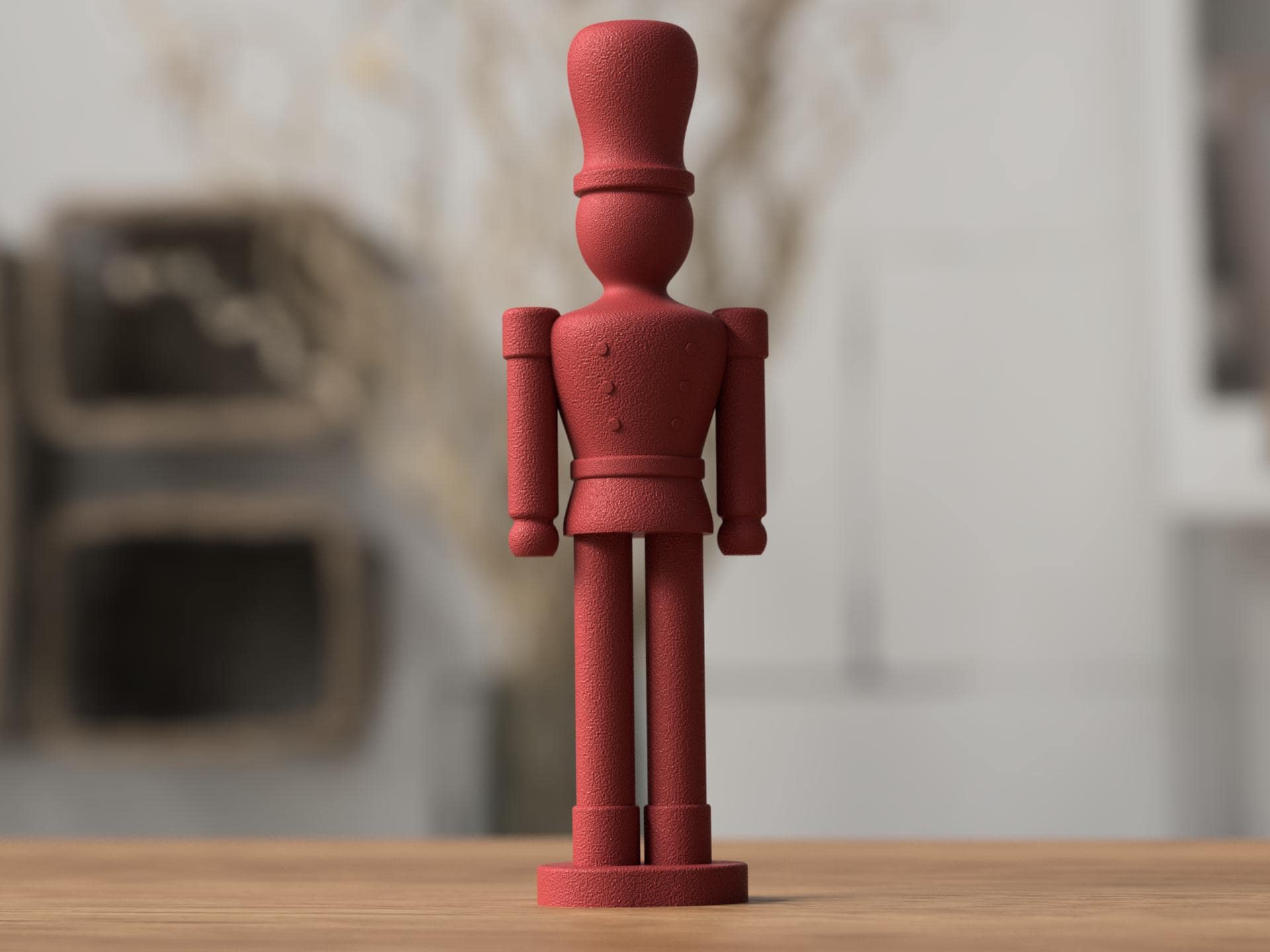 Red toy soldier figurine on a wooden surface with a blurred background