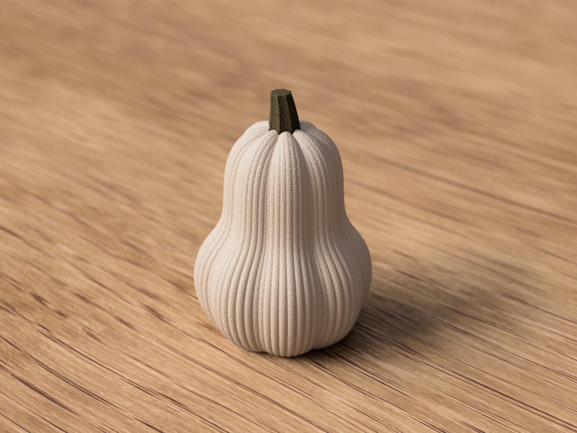 White decorative pumpkin on a wooden surface