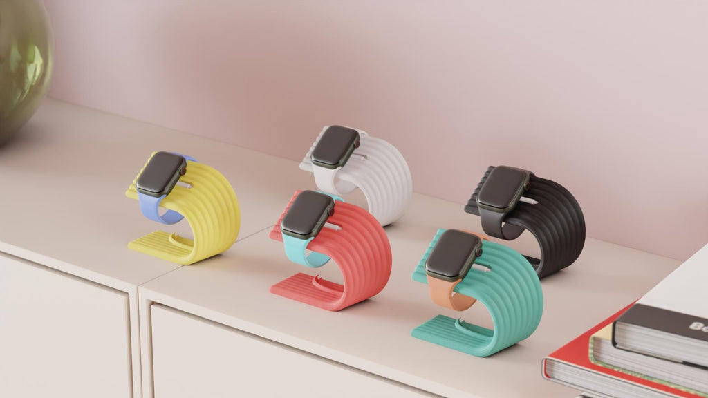 Colorful stand holders for smartwatches on a shelf with a neutral background