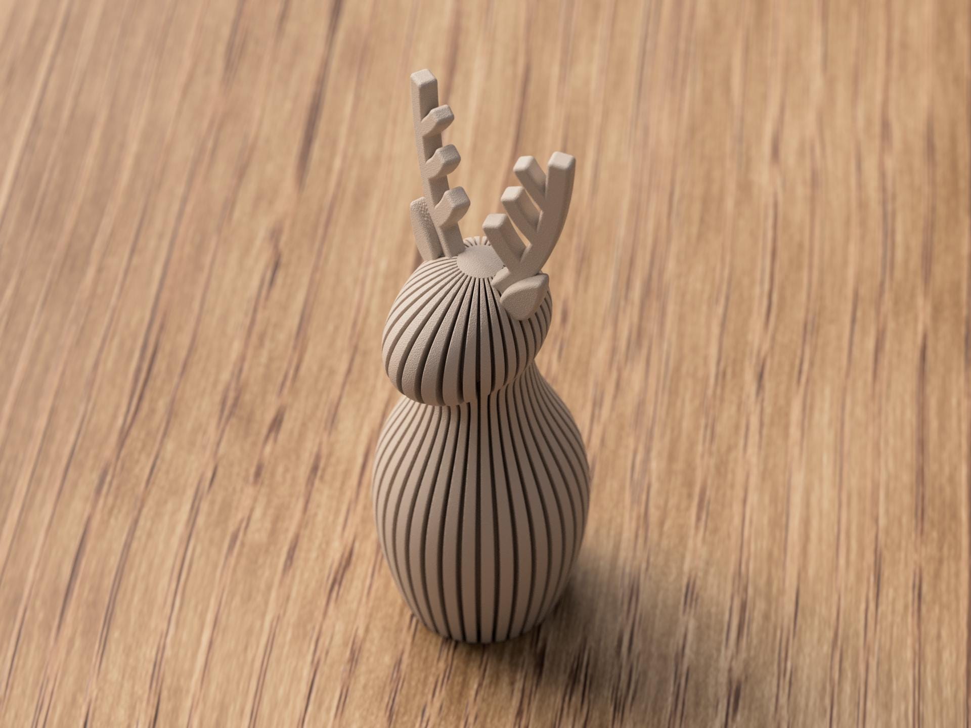Decorative object with antler-like design on a wooden surface
