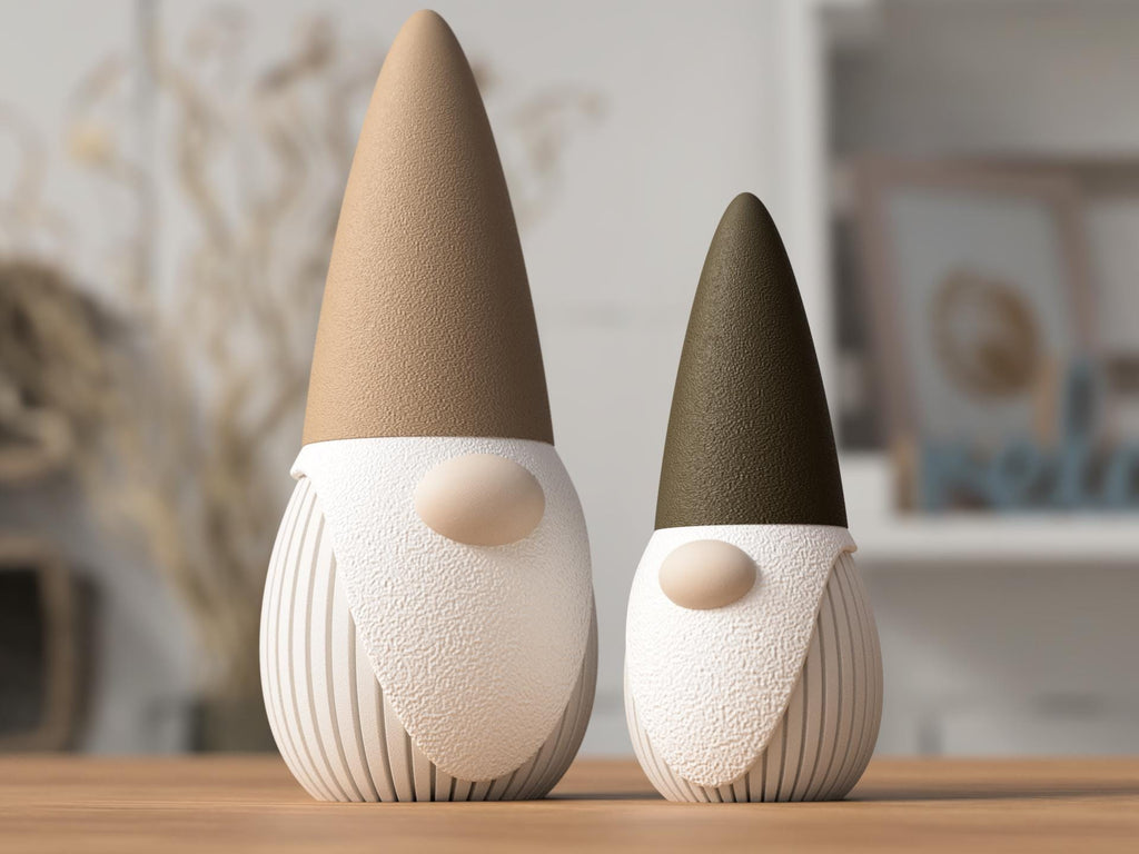 Two decorative gnomes with cone hats on a wooden surface.